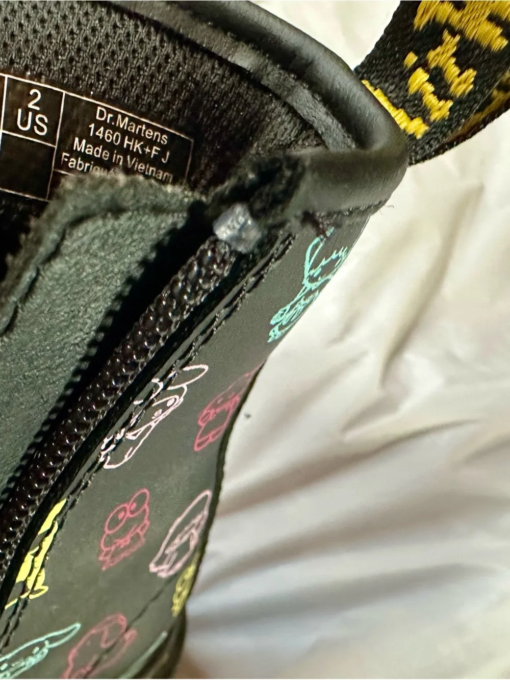 Dr. Martens Kids Black Boots with Multicolor Sanrio Print and Pink Bow Charm